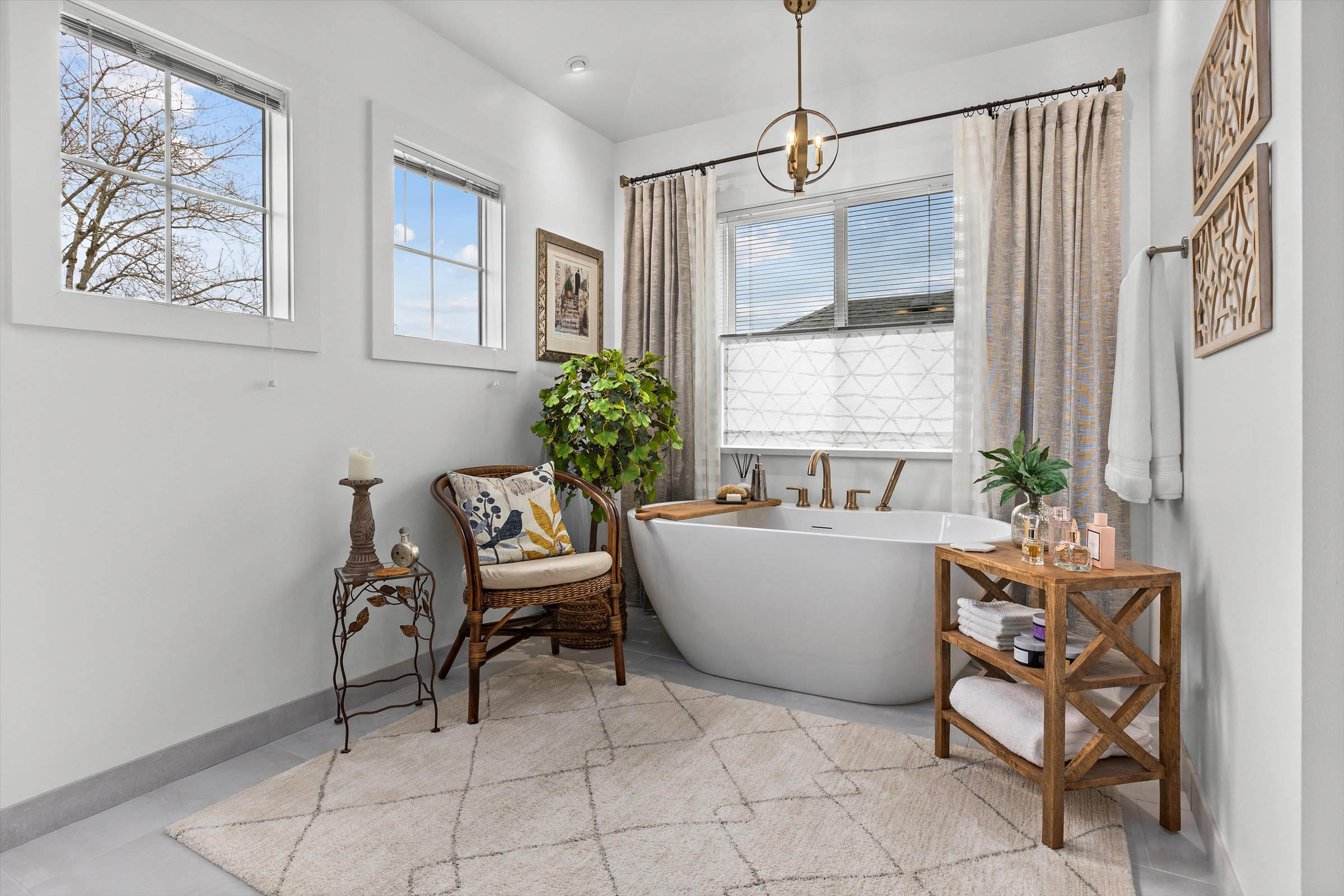 A bathroom with a tub, chair, and window. A serene space for relaxation and rejuvenation