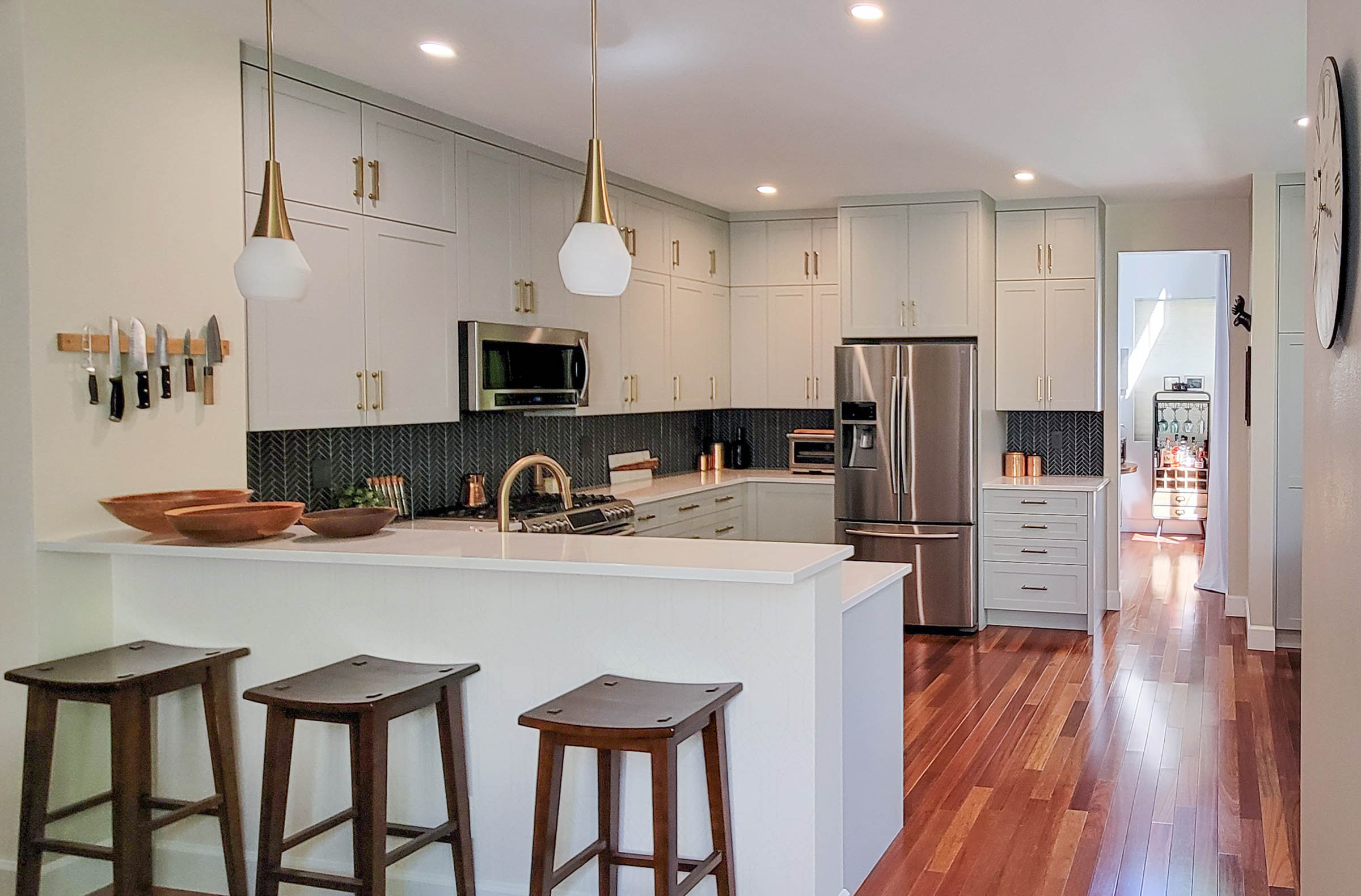 a view of a white kitchen